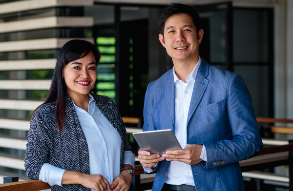 business people smiling at camera